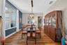 Positioned at the front of the home, this elegant formal dining area greets guests with style and charm.