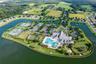 The community’s Activity Peninsula features an array of outdoor recreation amenities surrounded by scenic lake views.
