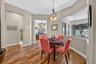 The cozy breakfast room offers a charming nook to enjoy morning coffee accompanied by serene lake views.