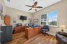 The expansive office offers exceptional flexibility, perfectly suited as a private work-from-home sanctuary, den, or library.