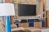 Custom made media wall with storage for all your entertainment equipment.