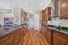 The beautifully appointed kitchen opens conveniently to a walk-in pantry and a dedicated indoor laundry room.