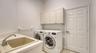 Laundry room with newer washer and dryer