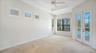 Master bedroom with lots of natural light and double french door to the lanai