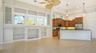 Tons of natural light in the great room and kitchen with transom windows and high soaring ceilings