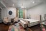 Spacious bedroom with dark woo