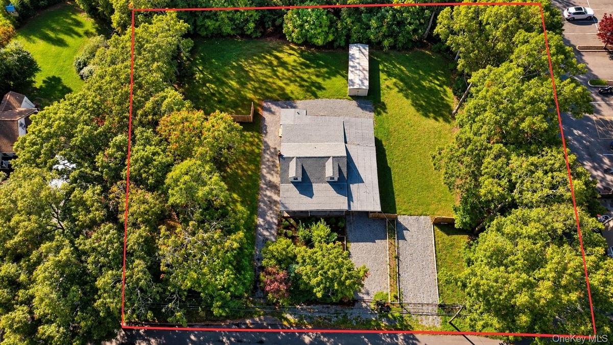 Aerial view of approximately 0.76 acre commercial property located at 10 Versa place Shirley