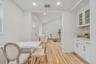 Breakfast nook in kitchen featuring perfectly designed cabinets with quarts counters