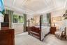 4th Bedroom en-suite could be used as 2nd primary, guest, inlaw or home office. Tray ceiling featuring decorative crown molding, large-format tile flo