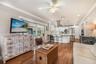 Open-concept kitchen family room with built-in wine cooler.
