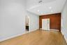 Primary bedroom with brick accent wall.