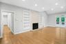 Ceiling to floor stone gas fireplace.