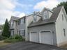 Front exterior with attached 2-car garage