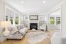 This living room sets the quality throughout the home from the custom built-ins, custom square transom windows distinctive custom detail, gas fireplac