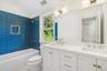 Second floor hall bathroom features dual vanity