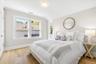 En-suite bedroom with custom fitted closet and full bathroom