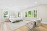 Primary bedroom- vaulted ceilings, two custom fitted closets, full bathroom with dual vanity and oversized shower, with additional seating area space.