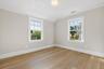 Second floor bedroom with custom fitted closet.