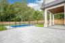 A covered rear porch overlooking the pool, an outdoor room for every season. For an evening out, Stella Trattoria on Montauk Highway is about five min