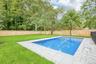 Sunlit pool and open lawn with room to play. Poolside dinner is easy with take-out from Tico's Empanadas or the Blue Point Diner, both about half a mi