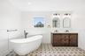 A freestanding tub beneath the window for long, unhurried soaks, the perfect close to afternoon tea at the Mad Batter Tea Room on Montauk Highway, abo