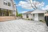 A paver patio and mahogany rear deck for evenings al fresco. Fill the planters from Bayport Flower Houses on Montauk Highway, a short drive west.