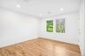 Soft light and wide-plank floors in another generous bedroom. Take-out night means empanadas and tostones from Tico's Empanadas, about half a mile awa