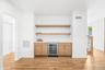 Dining room built-ins with built in wine fridge for effortless entertaining. After dessert, a sunset stroll to the Blue Point Dock on the Great South 