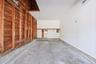 Garage interior featuring white walls, concrete flooring and plenty of space for storage or car