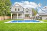 The rear facade over a new in-ground heated saltwater pool. Bring the bay home: Bodhi's beach bar at Corey Beach, about 0.7 miles away, hosts weekend 