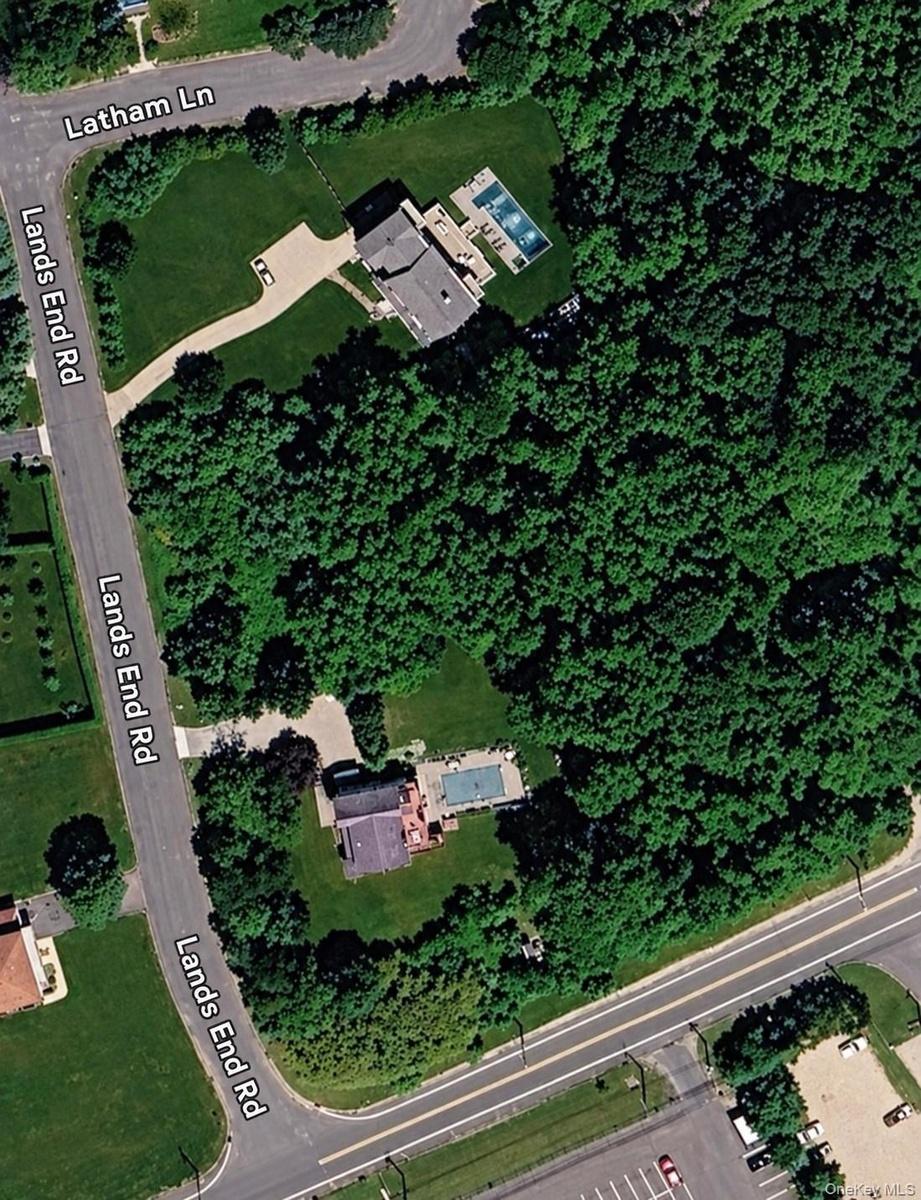 Aerial Survey. Depicting the physical boundaries, lot coverage, and site plan for the property