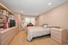 Primary bedroom with ensuite full bathroom and walk-in closet