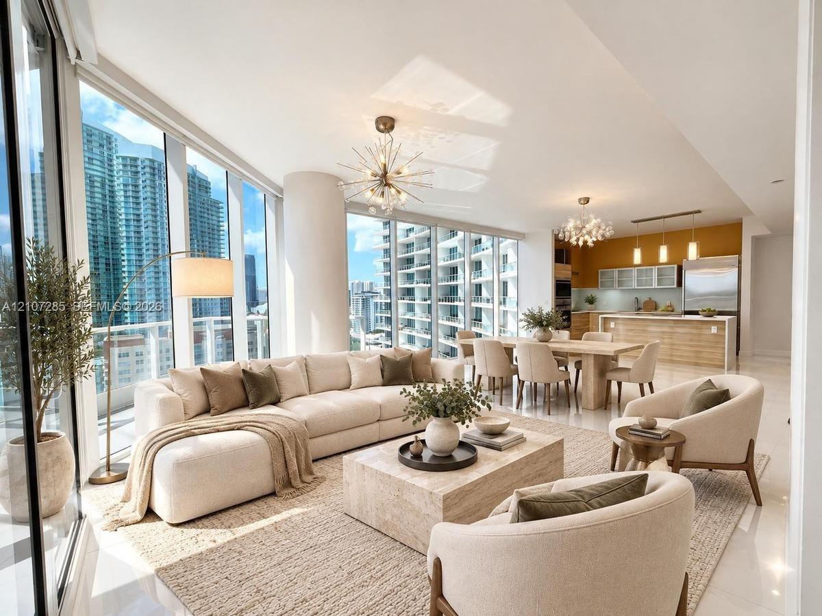Floor-to-ceiling glass windows, open-concept layout, modern sputnik-style chandeliers, kitchen island with built-in cabinetry, and polished neutral fl