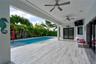 Covered patio featuring wood-finish flooring, dual ceiling fans, recessed lighting, and a private swimming pool