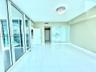 Polished tile flooring, floor-to-ceiling glass sliding doors, glass-enclosed shower, and decorative crystal flush-mount lighting