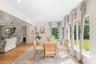 Dining area featuring wood-finish flooring, recessed lighting, and expansive wall-to-wall windows