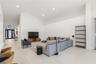 Vaulted ceilings, neutral ceramic tile flooring, recessed lighting, and a multi-pane glass entry door