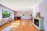 Step inside to the front living room with fantastic hardwood floors, and sunny bay window!