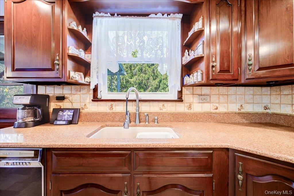 Large kitchen overlooks the pool with plenty of cabinets and easy flow to the adjacent dining room.