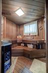 This sauna room also serves as a FULL BATH with a sink, toilet and stand-up shower.