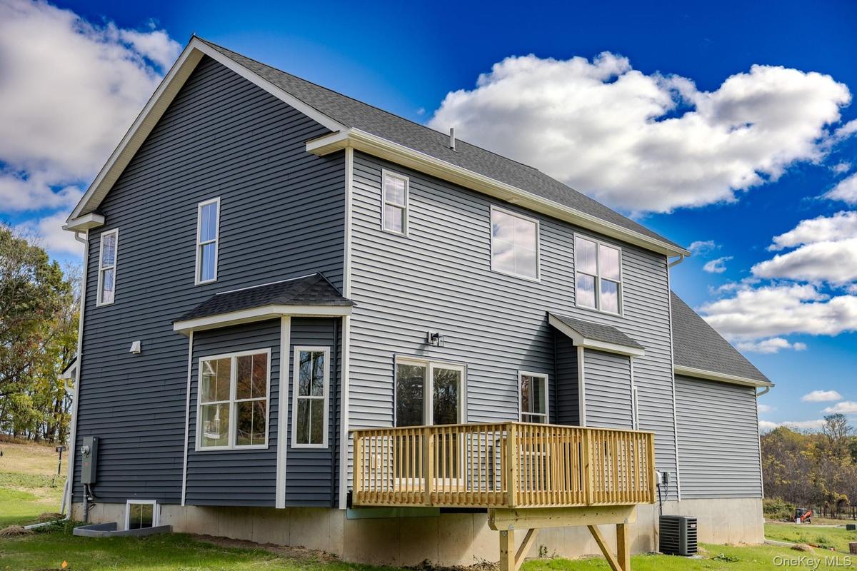 Back View of Newly Complete Carson Model Rear Elevation Featuring Deck.