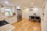 Kitchen featuring white shaker-style cabinetry, stainless steel appliances, recessed lighting, and wood-finish flooring