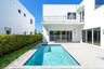 Contemporary exterior featuring a private swimming pool, concrete paver patio, second-story balcony with metal railing, and expansive glass sliding do