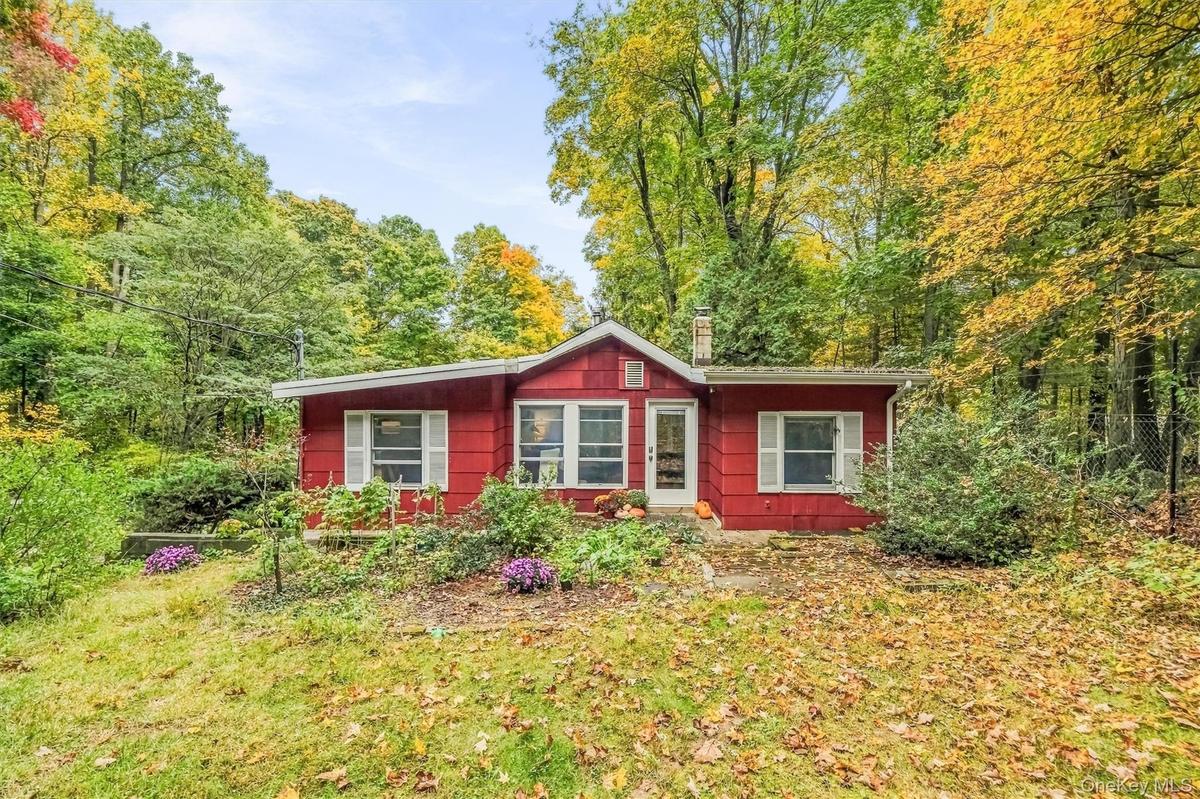 Cheerful and welcoming this 1940 Ranch nestled on 1.3 acres.
