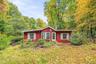 Cheerful and welcoming this 1940 Ranch nestled on 1.3 acres.