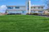 Front of property with a lawn