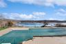 View of pool featuring a water view