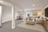 Virtually Staged- Finished recreation room with and egress window