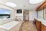 Bathroom with vanity and separate shower and tub