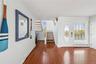 Entrance foyer featuring a baseboard radiator and dark hardwood / wood-style flooring